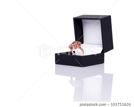 Tourmaline and Diamond Jewel or gems ring in dark blue jewel box. Collection of natural gemstones accessories. Studio shot Tourmaline and Diamond Jewel or gems ring in dark blue jewel box. Collection of natural gemstones accessories. Studio shot 103751626