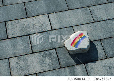 flat rock with a rainbow flag on the street flat rock with a rainbow flag on the street 103751897