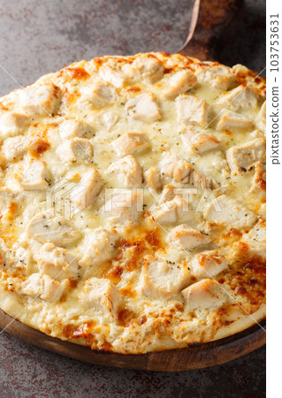 White Cheese Pizza with Chicken closeup on the wooden board. Vertical 103753631