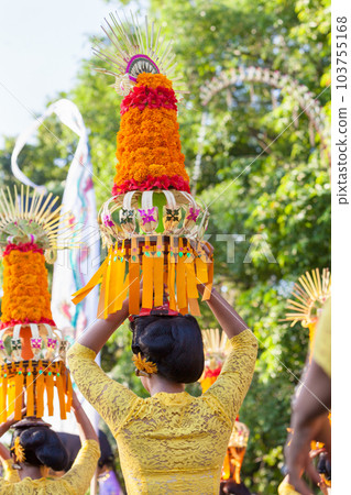 Procession of beautiful Balinese women in traditional costumes Procession of beautiful Balinese women in traditional costumes 103755168