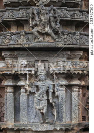 Carved sculptures of Hindu Gods with weapons on the Bugga Ramalingeswara Temple, Tadiptri, Andhra Pradesh, India. Carved sculptures of Hindu Gods with weapons on the Bugga Ramalingeswara Temple, Tadiptri, Andhra Pradesh, India. 103757569