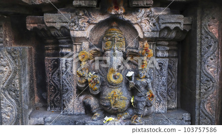 Ancient Carved sculpture of Lord Ganesha on the Bugga Ramlingeswara Temple, Tadipatri, Andhra Pradesh, India. Ancient Carved sculpture of Lord Ganesha on the Bugga Ramlingeswara Temple, Tadipatri, Andhra Pradesh, India. 103757586
