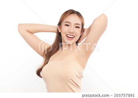 Beautiful Young Asian woman lifting hands up to show off clean and hygienic armpits or underarms on white background, Smooth armpit cleanliness and protection concept Beautiful Young Asian woman lifting hands up to show off clean and hygienic armpits or underarms on white background, Smooth armpit cleanliness and protection concept 103757891