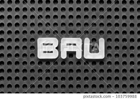 White alphabet letter in word BAU (abbreviation of business as usual) on black pegboard background White alphabet letter in word BAU (abbreviation of business as usual) on black pegboard background 103759988