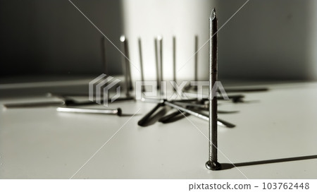 One hobnail in the foreground close-up. Company leader. Outcast in society. 103762448