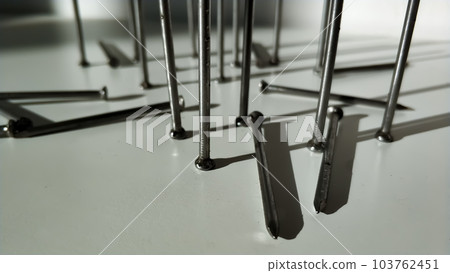 Lots of big new hobnails a hardware stand on hats close-up Light and shadow. Lots of big new hobnails a hardware stand on hats close-up Light and shadow. 103762451