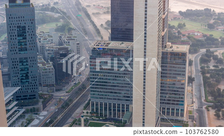 Office skyscrapers in financial district aerial night to day timelapse 103762580