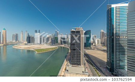 Cityscape skyscrapers of Dubai Business Bay with water canal aerial timelapse. Cityscape skyscrapers of Dubai Business Bay with water canal aerial timelapse. 103762594