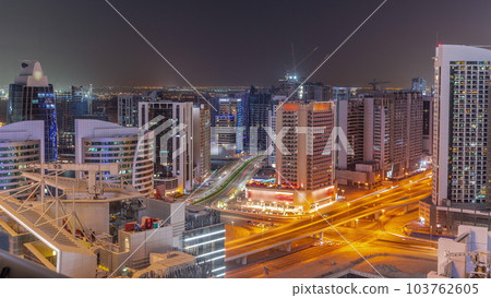 Skyscrapers at the Business Bay in Dubai aerial day to night timelapse, United Arab Emirates Skyscrapers at the Business Bay in Dubai aerial day to night timelapse, United Arab Emirates 103762605