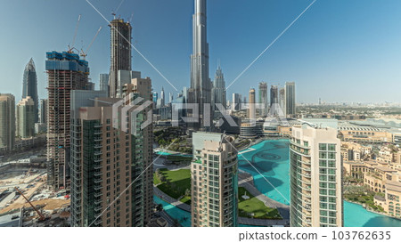 Panorama showing Dubai Downtown cityscape with tallest skyscrapers around aerial timelapse. Panorama showing Dubai Downtown cityscape with tallest skyscrapers around aerial timelapse. 103762635