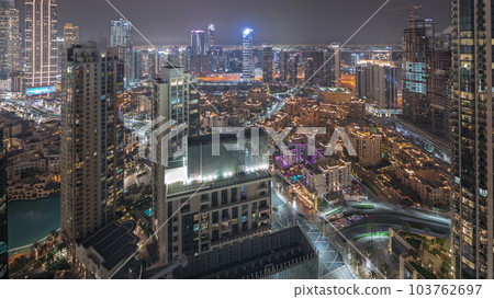 Panorama showing aerial view of a big futuristic city night timelapse. Business bay and Downtown 103762697