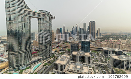 Pnorama showing futuristic Dubai Downtown and finansial district skyline aerial timelapse. 103762699