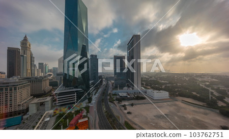 Dubai International Financial district aerial night to day timelapse. Panoramic view of business office towers. Dubai International Financial district aerial night to day timelapse. Panoramic view of business office towers. 103762751