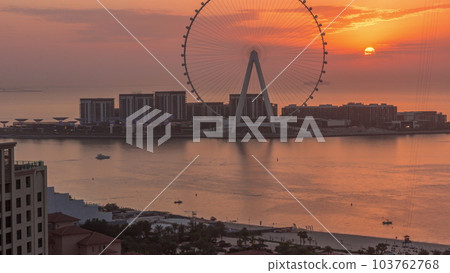 Sunset over Bluewaters island with modern architecture and ferris wheel aerial timelapse. Sunset over Bluewaters island with modern architecture and ferris wheel aerial timelapse. 103762768
