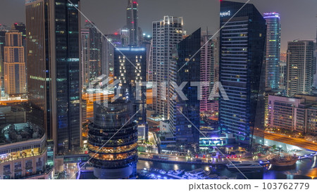 Dubai Marina Skyline with JLT district skyscrapers on a background aerial all night timelapse. 103762779