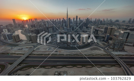 Sunset over panoramic skyline of Dubai with business bay and downtown district timelapse. 103762829