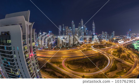 Dubai Marina highway intersection spaghetti junction day to night timelapse Dubai Marina highway intersection spaghetti junction day to night timelapse 103762901