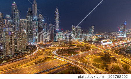 Dubai Marina highway intersection spaghetti junction day to night timelapse Dubai Marina highway intersection spaghetti junction day to night timelapse 103762902
