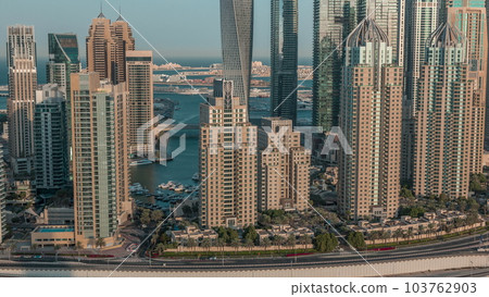 Skyscrapers of Dubai Marina near Sheikh Zayed Road with highest residential buildings morning timelapse Skyscrapers of Dubai Marina near Sheikh Zayed Road with highest residential buildings morning timelapse 103762903