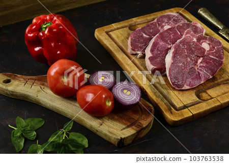 Patagonian lamb meat presented on the wooden table, Patagonia Argentina. Patagonian lamb meat presented on the wooden table, Patagonia Argentina. 103763538