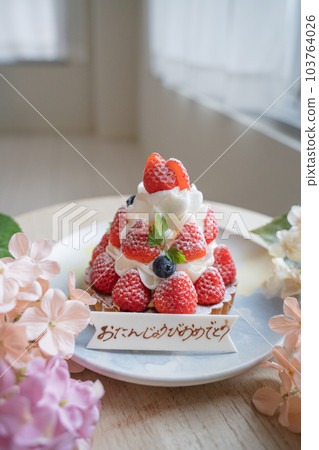 Birthday strawberry tart and flowers 103764026