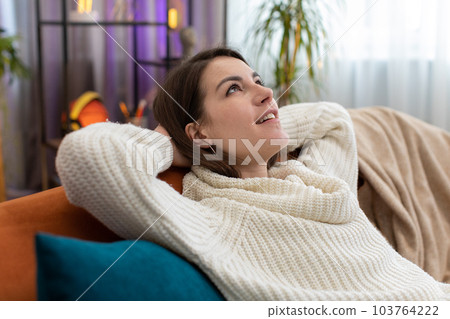 Tired lazy woman enjoy relaxing on home sofa resting napping after hard working day, closed her eyes 103764222