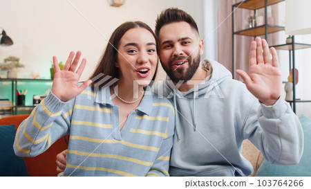 POV family man woman at home looking at camera, making video conference call with friends or family 103764266