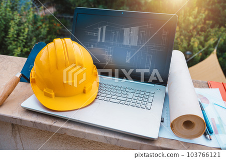 Laptop of a architect who plans a house 103766121