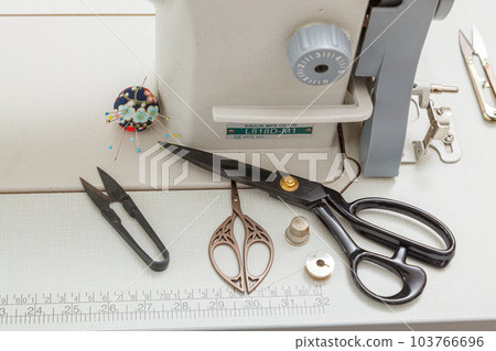 Sewing machine with sewing tools, scissors, threads Sewing machine with sewing tools, scissors, threads 103766696