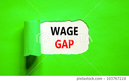 Wage gap symbol. Concept words Wage gap on beautiful white paper on a beautiful green background. Business, support and wage gap concept. Copy space. Wage gap symbol. Concept words Wage gap on beautiful white paper on a beautiful green background. Business, support and wage gap concept. Copy space. 103767228