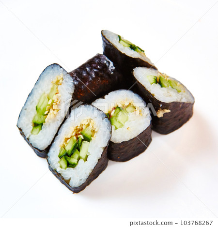 Japanese cuisine. Sushi roll with avocado on white background Japanese cuisine. Sushi roll with avocado on white background 103768267