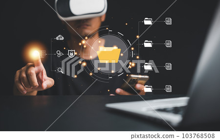 Virtual reality VR office setup featuring an IT consultant utilizing a Document Management System DMS. Emphasizing the importance of digital file organization in the modern business world. Virtual reality VR office setup featuring an IT consultant utilizing a Document Management System DMS. Emphasizing the importance of digital file organization in the modern business world. 103768508