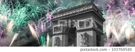 Celebratory colorful fireworks over the Arc de Triomphe, Paris, France. The walls of the arch are engraved with the names of 128 battles and names of 660 French military leaders (in French) Celebratory colorful fireworks over the Arc de Triomphe, Paris, France. The walls of the arch are engraved with the names of 128 battles and names of 660 French military leaders (in French) 103769580