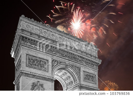 Celebratory colorful fireworks over the Arc de Triomphe, Paris, France 103769836