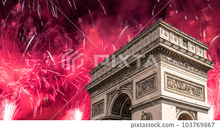 Celebratory colorful fireworks over the Arc de Triomphe, Paris, France 103769867