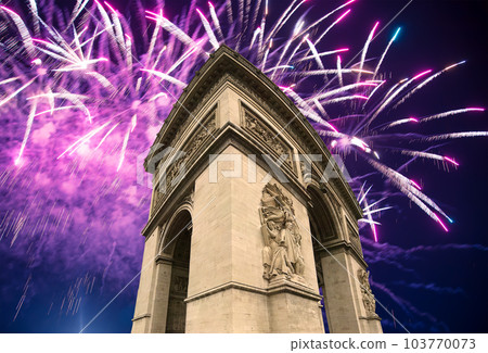 Celebratory colorful fireworks over the Arc de Triomphe, Paris, France 103770073