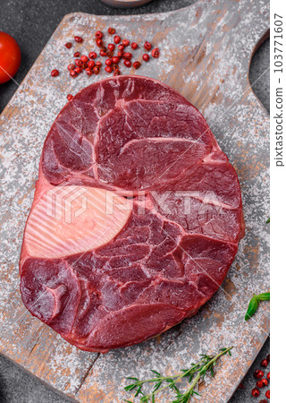 Fresh beef ossobuco steak with salt, spices and herbs 103771607