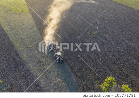 Tractor plowing the field, Pampas countryside, La Pampa, Argentina. 103771781