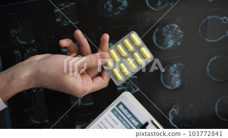 Tablets, pills and vitamins in the hands 103772841