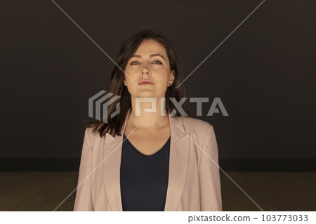 Portrait Confident Mature 40 yo Beautiful Woman. Caucasian Burnette Female With Brown Eyes Looks At Camera, Wears Pink Jackets,Blue Shirt 103773033