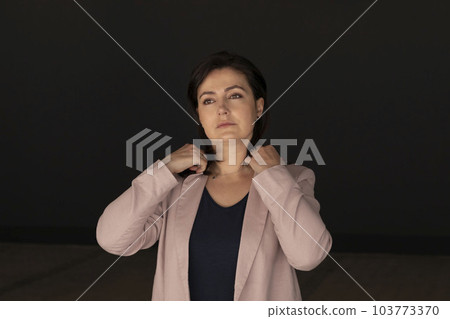 Portrait Confident Mature 40 yo Beautiful Woman. Caucasian Burnette Female With Brown Eyes Looks At Camera, Wears Pink Jackets,Blue Shirt 103773370
