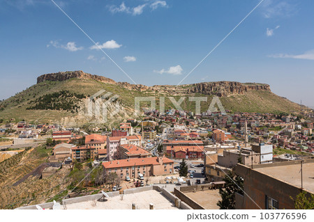 Townscape and rocky mountains seen from the old town of Mardin, Türkiye Townscape and rocky mountains seen from the old town of Mardin, Türkiye 103776596