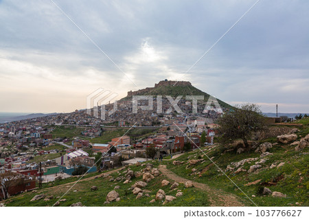 Turkey: Mardin Castle on the mountaintop with the streets of the old town spreading on the slopes of the mountain Turkey: Mardin Castle on the mountaintop with the streets of the old town spreading on the slopes of the mountain 103776627