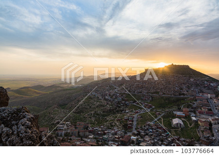 Turkey The cityscape of the old town of Mardin seen from the hill, Mardin castle standing on the mountaintop and the sunset sky Turkey The cityscape of the old town of Mardin seen from the hill, Mardin castle standing on the mountaintop and the sunset sky 103776664