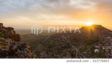 Turkey The cityscape of the old town of Mardin seen from the hill, Mardin castle standing on the mountaintop and the sunset sky Turkey The cityscape of the old town of Mardin seen from the hill, Mardin castle standing on the mountaintop and the sunset sky 103776667