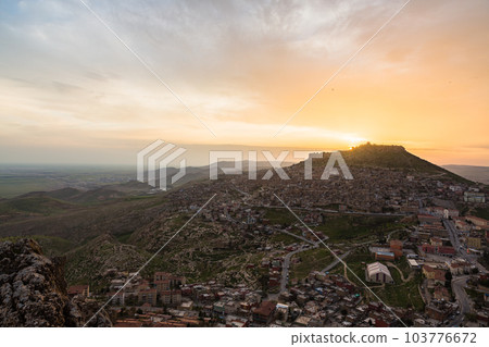 Turkey The cityscape of the old town of Mardin seen from the hill, Mardin castle standing on the mountaintop and the sunset sky Turkey The cityscape of the old town of Mardin seen from the hill, Mardin castle standing on the mountaintop and the sunset sky 103776672