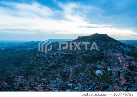 Turkey The townscape of Mardin's old town spread out on the slopes of the mountain at dusk and Mardin Castle standing on the top of the mountain Turkey The townscape of Mardin's old town spread out on the slopes of the mountain at dusk and Mardin Castle standing on the top of the mountain 103776722