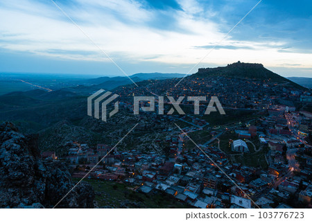 Turkey The townscape of Mardin's old town spread out on the slopes of the mountain at dusk and Mardin Castle standing on the top of the mountain Turkey The townscape of Mardin's old town spread out on the slopes of the mountain at dusk and Mardin Castle standing on the top of the mountain 103776723