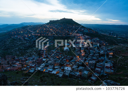 Turkey The townscape of Mardin's old town spread out on the slopes of the mountain at dusk and Mardin Castle standing on the top of the mountain Turkey The townscape of Mardin's old town spread out on the slopes of the mountain at dusk and Mardin Castle standing on the top of the mountain 103776726