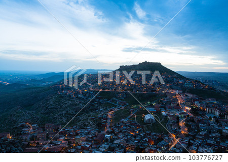 Turkey The townscape of Mardin's old town spread out on the slopes of the mountain at dusk and Mardin Castle standing on the top of the mountain Turkey The townscape of Mardin's old town spread out on the slopes of the mountain at dusk and Mardin Castle standing on the top of the mountain 103776727